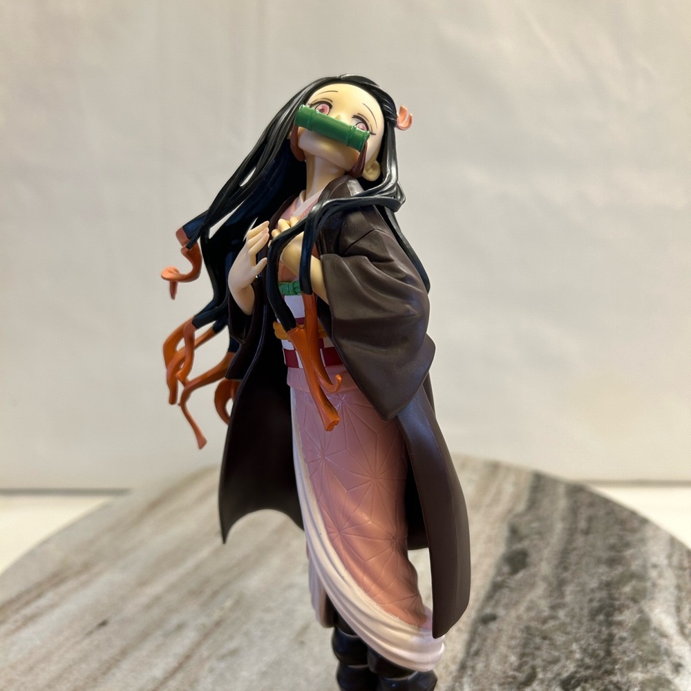 Anime Figure with Black and Orange Details